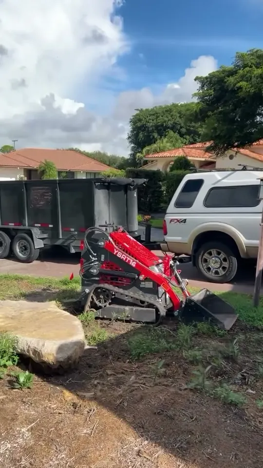 Bobcat site work in a front yard