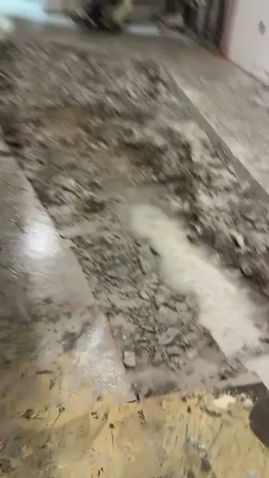 Old flooring torn out down to the concrete slab