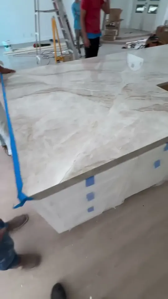 Marble countertop being installed with an undermount sink cutout