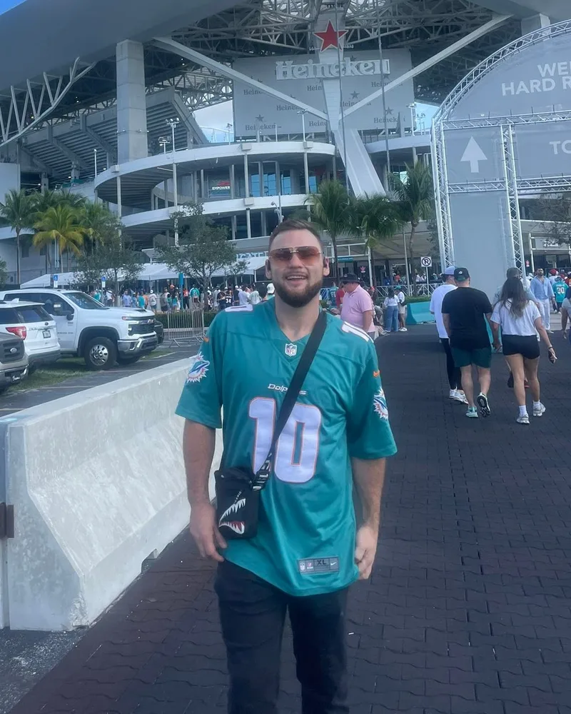 Joseph O'Donnell, owner of Kodak Construction, outside Hard Rock Stadium in a Dolphins jersey