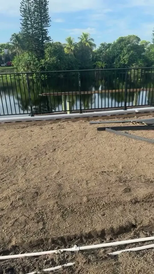 Turf and grading by a lake